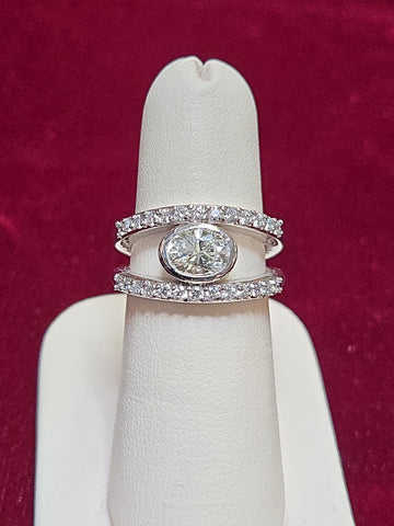 14K white gold ring featuring a 1.04ct oval diamond from Chique Jewelry, showcasing elegant craftsmanship and sparkling gemstone.
