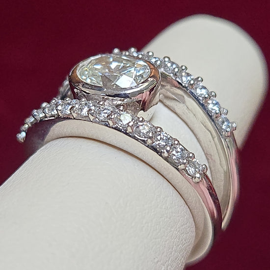 14K white gold ring featuring a 1.04ct oval diamond, crafted by Chique Jewelry, showcasing elegant design and fine craftsmanship.