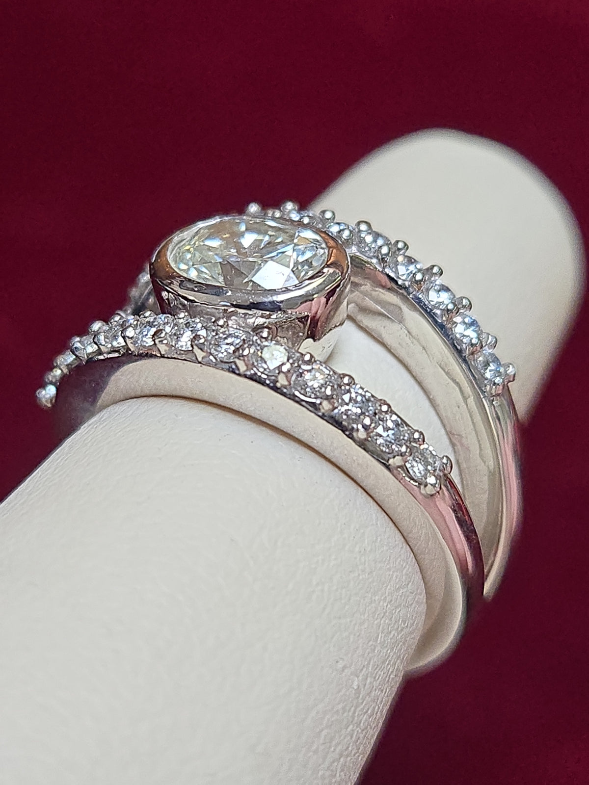 14K white gold ring featuring a 1.04ct oval diamond, crafted by Chique Jewelry, showcasing elegant design and fine craftsmanship.