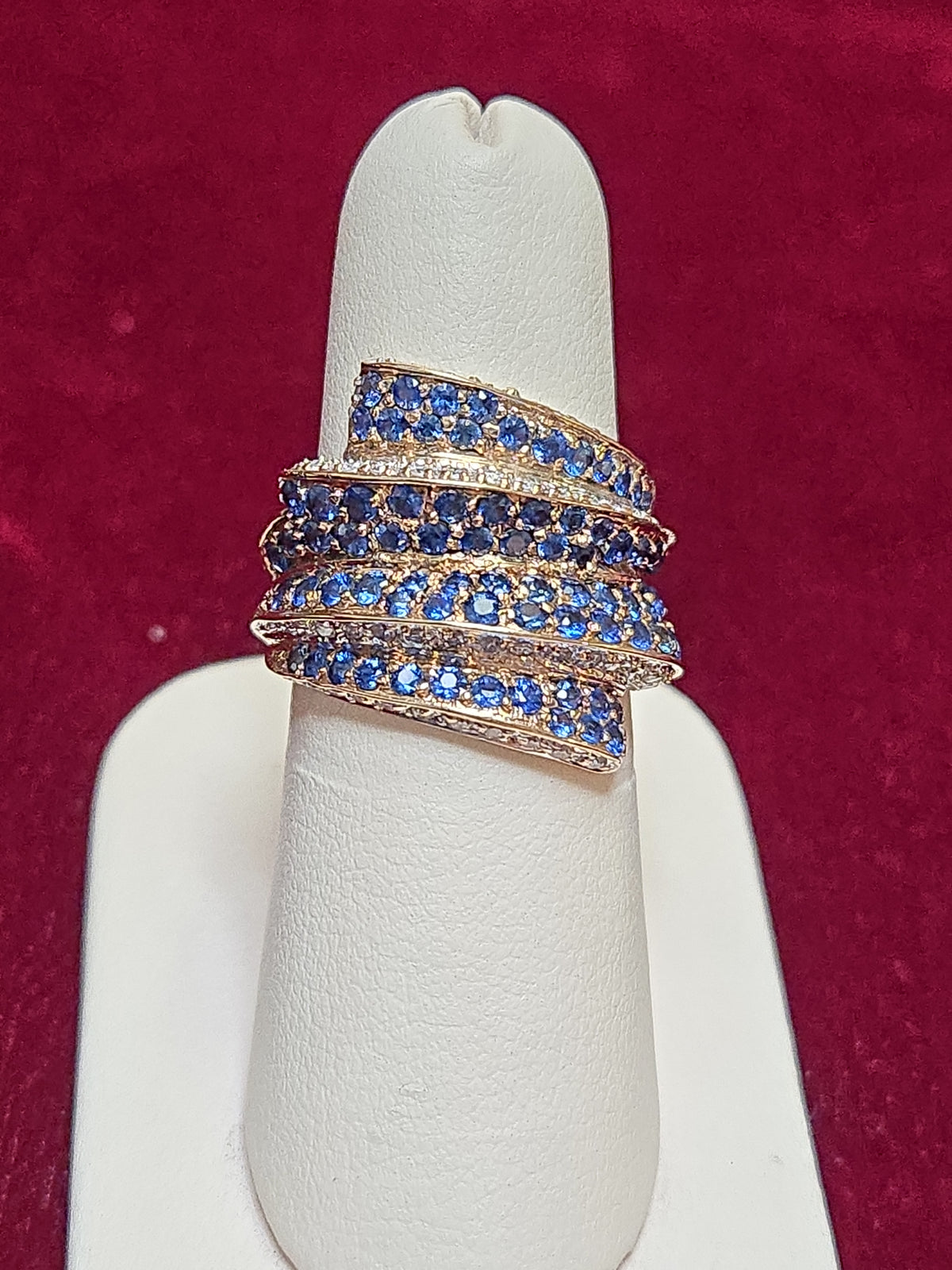 14K gold cocktail ring with 2ct round blue sapphire, featuring elegant design and shiny gold band from Chique Jewelry.