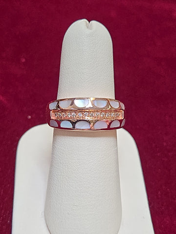 14K rose gold ring with 0.2ct round diamond, crafted by Chique Jewelry, showcasing elegant jewelry design.