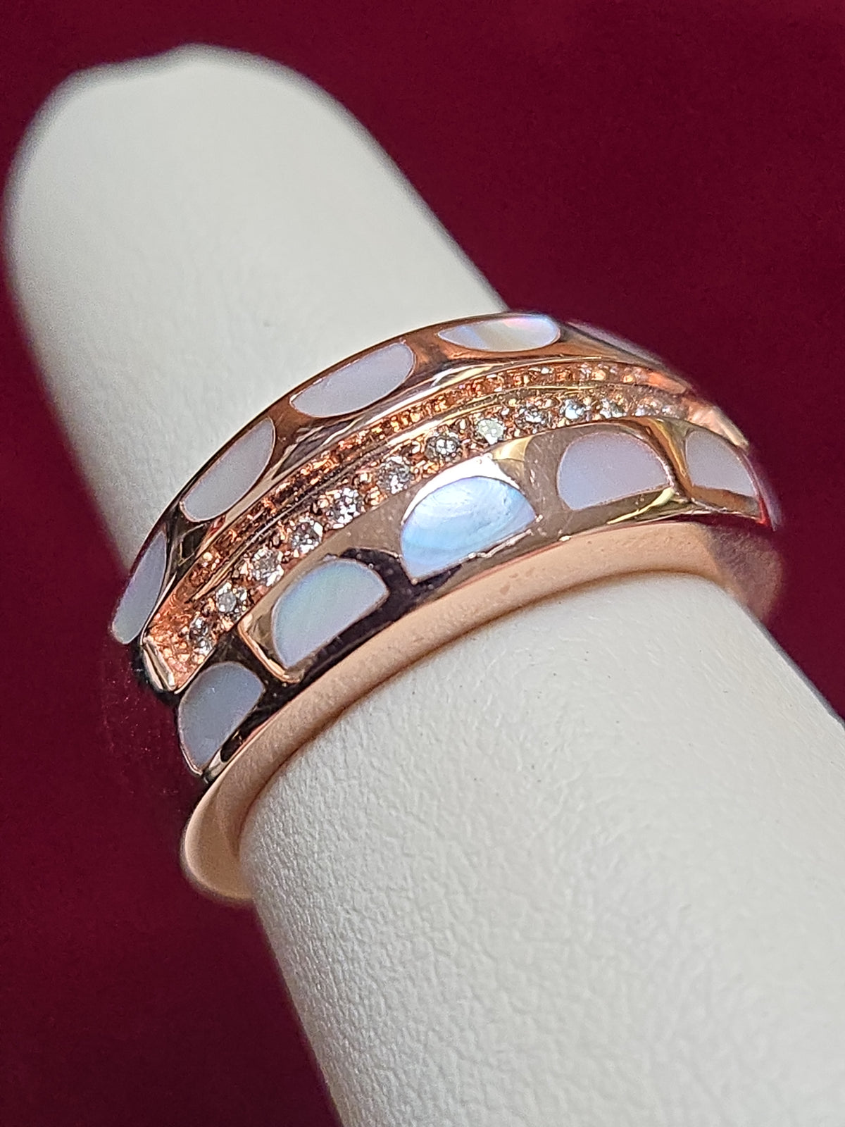 14K rose gold ring with a 0.2ct round diamond, crafted by Chique Jewelry, featuring an elegant design and polished finish.