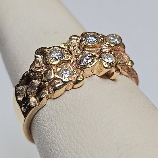 14K gold ring with 0.5ct round diamonds from Chique Jewelry, featuring a polished band and sparkling gemstone accents.