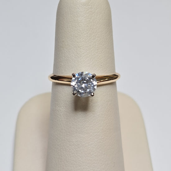 14K gold engagement ring with round cubic zirconia and 2.3g weight, showcasing a sparkling central stone and elegant band.