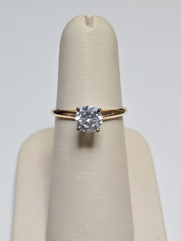 14K gold engagement ring with round cubic zirconia and 2.3g weight, showcasing a sparkling central stone and elegant band.
