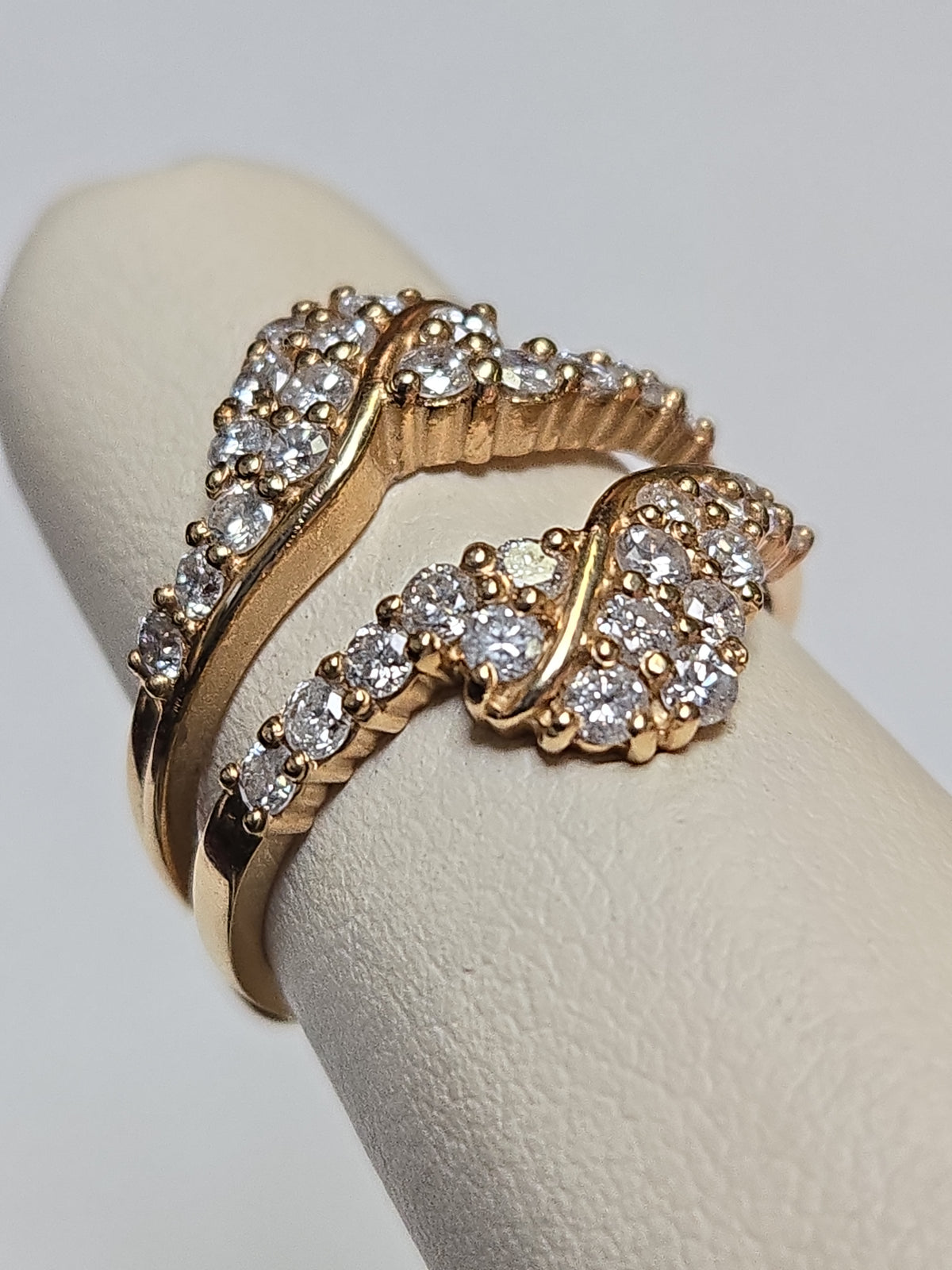 14K gold wedding ring with 1.01ct round diamonds, crafted by Chique Jewelry, featuring a sleek, elegant band and sparkling stones.