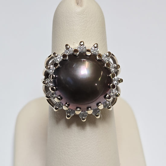 14K gold ring featuring a round Mabe pearl, crafted by Chique Jewelry, showcasing elegant design and shiny gold finish.