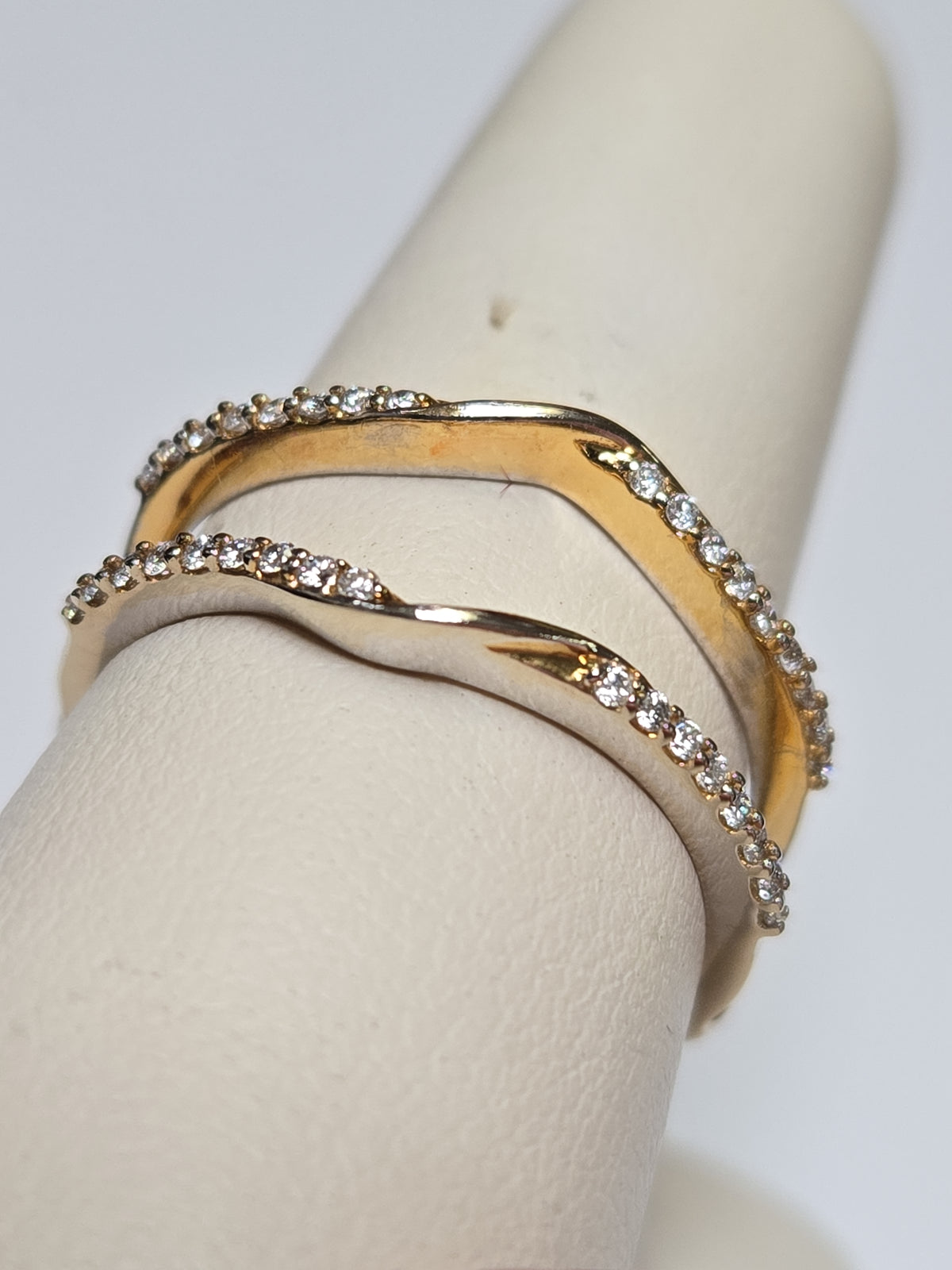 14K gold ring with 0.33ct round diamonds from Chique Jewelry, featuring a sleek design and sparkling gemstone accents.