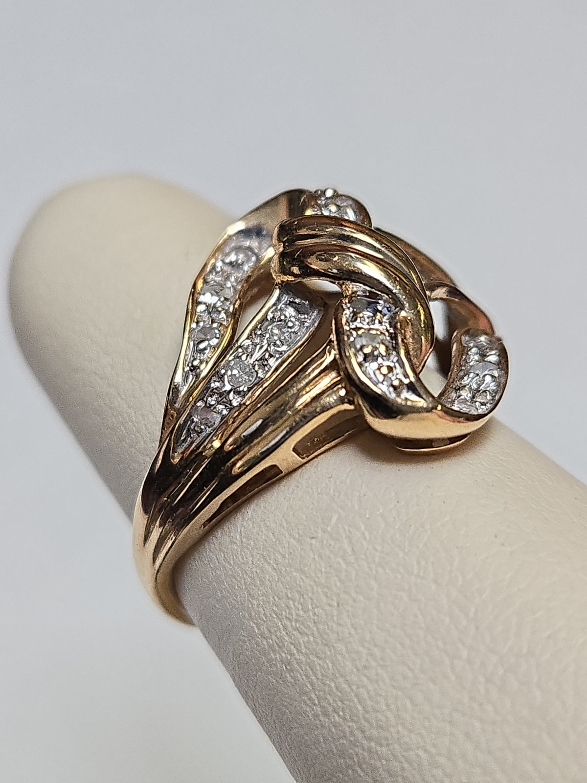 10K gold ring with 0.3ct round diamonds from Chique Jewelry, showcasing a sleek design and sparkling gemstone accents.