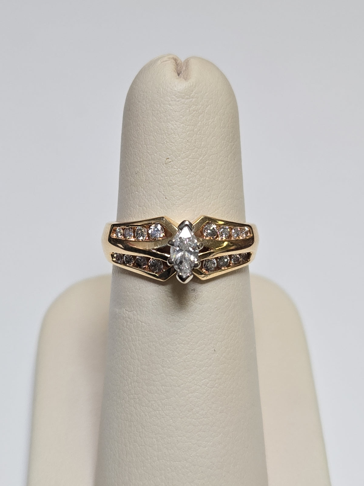 14K gold engagement ring with a 0.2ct marquise diamond, featuring elegant design by Chique Jewelry.