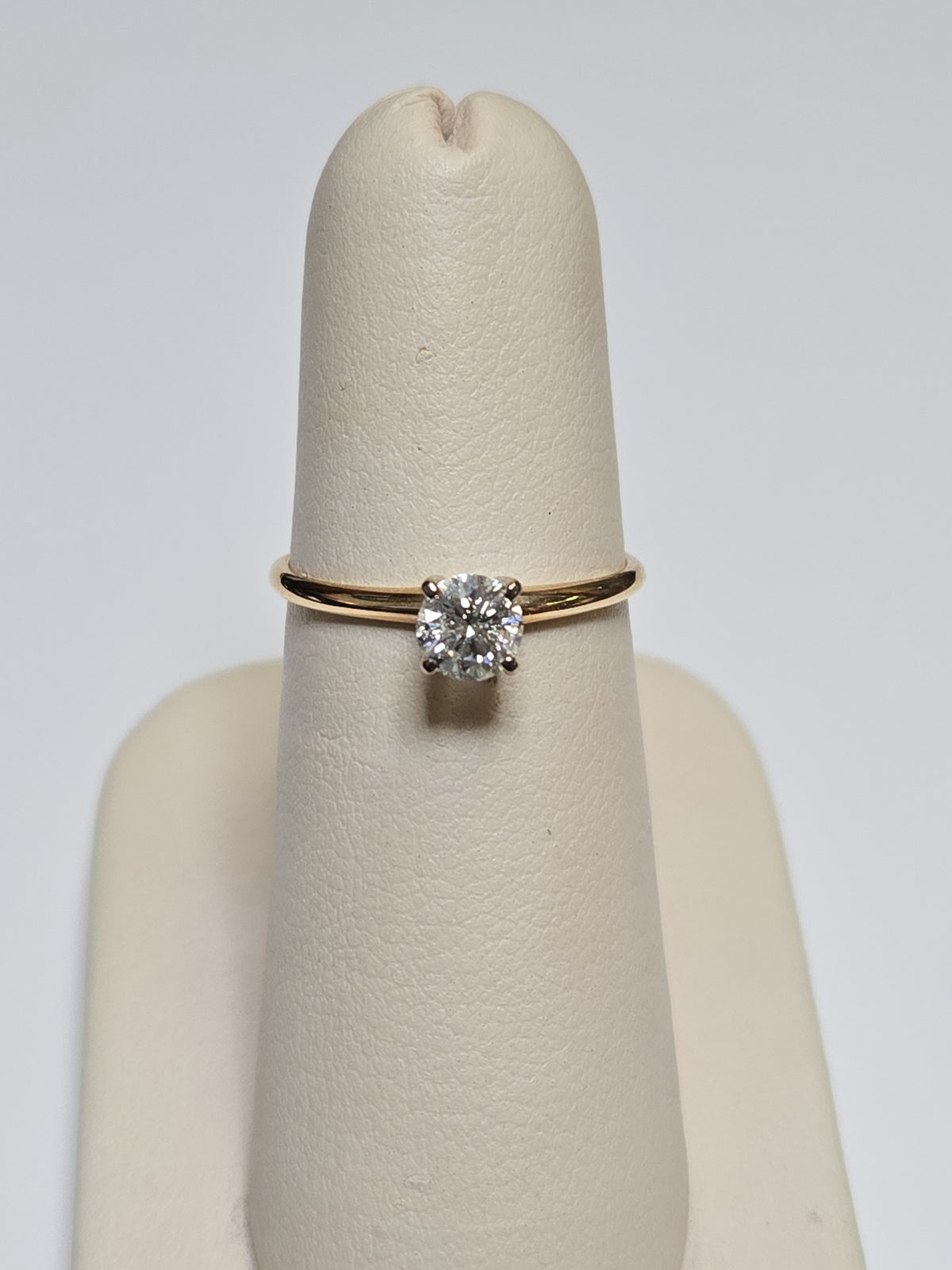 14K gold engagement ring with a 0.44ct round diamond and delicate band, by Chique Jewelry