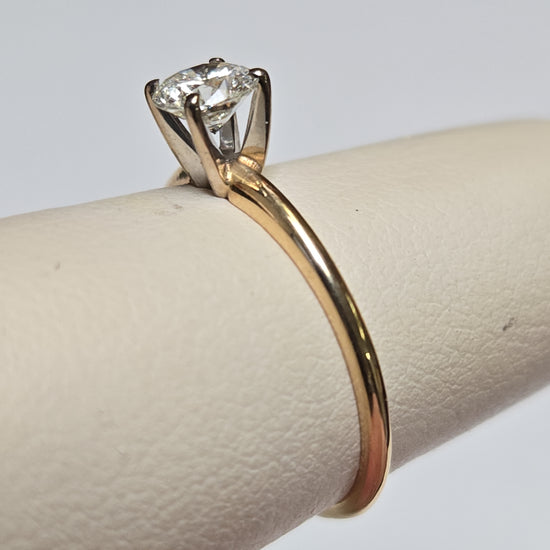 14K gold engagement ring with 0.44ct round diamond, delicate design by Chique Jewelry, featuring a sleek band and sparkling gemstone.