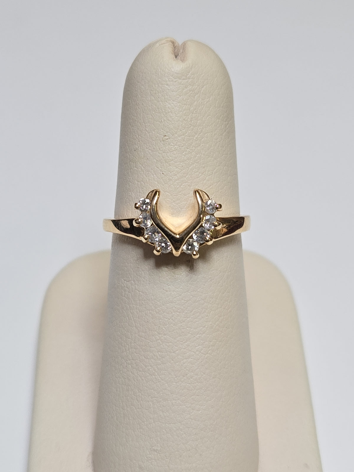 14K gold wedding ring with 0.28ct round diamonds from Chique Jewelry, featuring a polished band and sparkling gemstone accents.