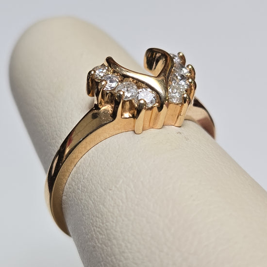 14K gold wedding ring with 0.28ct round diamonds, sleek design, from Chique Jewelry, showcasing the elegant band and sparkling stones.