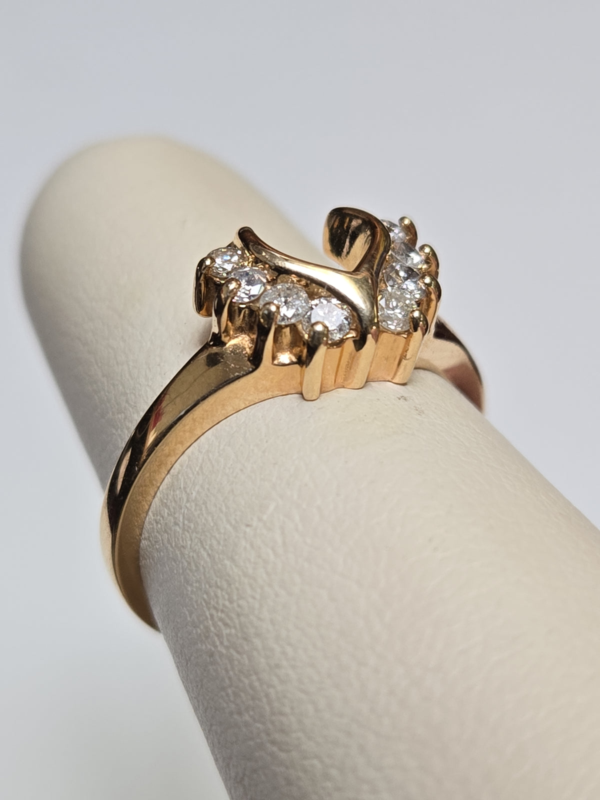 14K gold wedding ring with 0.28ct round diamonds, sleek design, from Chique Jewelry, showcasing the elegant band and sparkling stones.