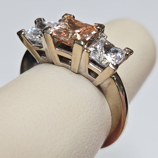 14K white gold three stone ring featuring princess-cut simulated Lannyte diamonds, elegant jewelry piece.