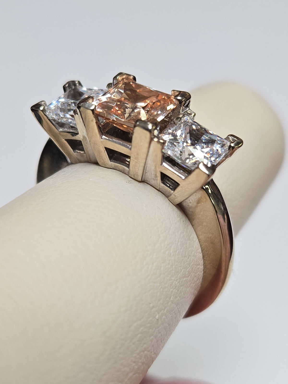 14K white gold three stone ring featuring princess-cut simulated Lannyte diamonds, elegant jewelry piece.