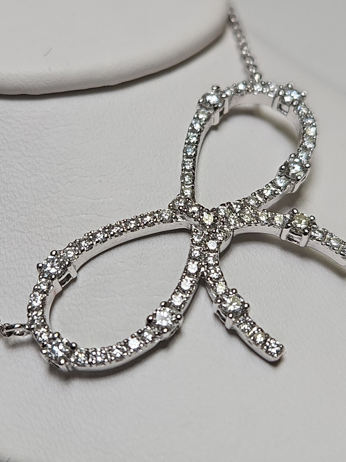 18K white gold cable chain necklace with a 0.85ct round diamond pendant, from Chique Jewelry, weighing 5.2 grams.