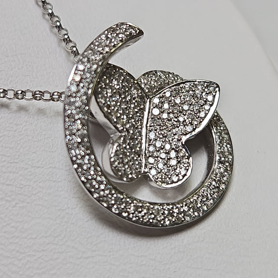 14K white gold rolo chain necklace with butterfly pendant featuring 0.41ct round diamonds from Chique Jewelry.