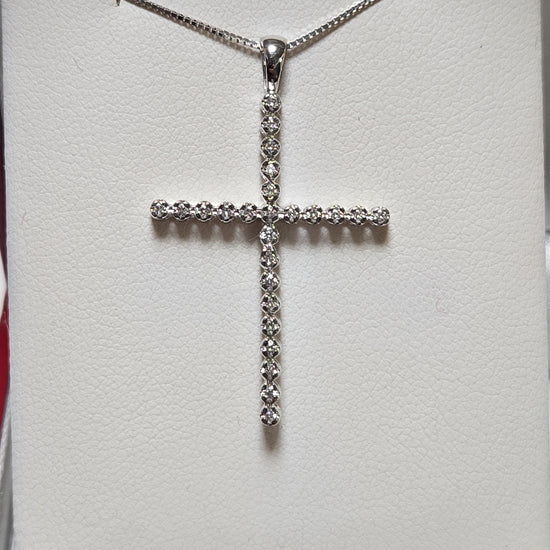 14K white gold cross pendant with 0.25ct round lab-created diamonds, weighing 1.6g, from Chique Jewelry.