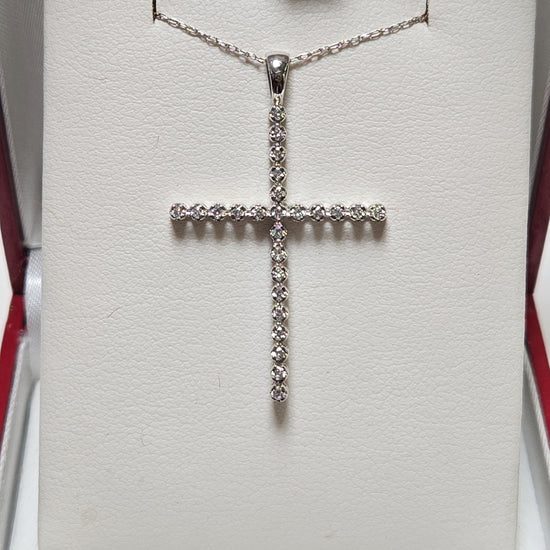 14K white gold cross pendant with 0.25ct round lab-created diamonds, weighing 1.6g, from Chique Jewelry.
