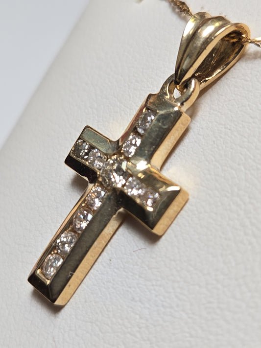 14K gold cross pendant with 0.6ct round diamonds from Chique Jewelry, showcasing intricate jewelry design and sparkling gemstones.