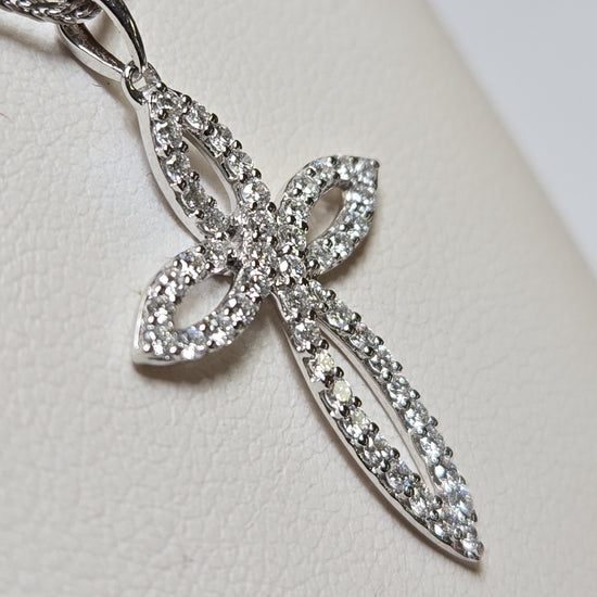 14K white gold cross pendant with 0.5ct round lab-created diamonds, featuring a delicate design and polished finish.