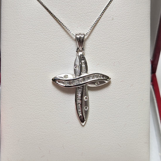 14K white gold cross pendant with 0.35ct baguette diamonds, weighing 2.5g, by Chique Jewelry, displayed on a plain background.
