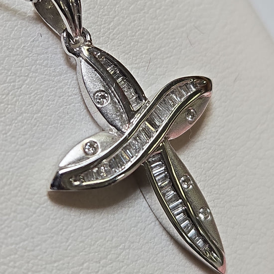 14K white gold cross pendant with 0.35ct baguette diamonds from Chique Jewelry, showcasing intricate design and sparkling stones.