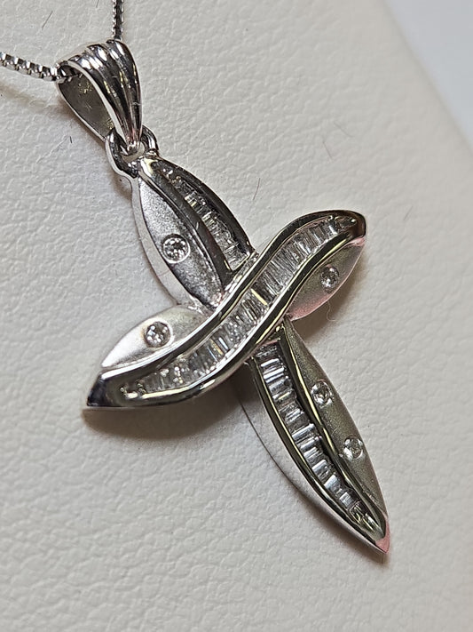 14K white gold cross pendant with 0.35ct baguette diamonds from Chique Jewelry, showcasing intricate design and sparkling stones.