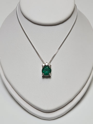 14K white gold pendant necklace featuring a 0.83ct oval emerald gemstone, crafted by Chique Jewelry.