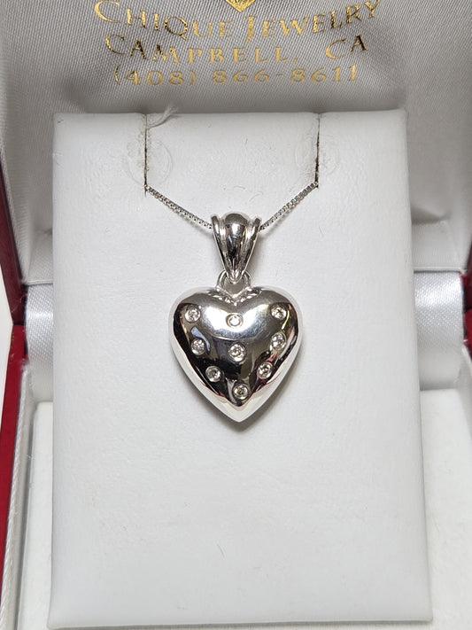 14K white gold heart pendant with 0.14ct round diamonds from Chique Jewelry, showcasing a delicate, elegant jewelry piece.