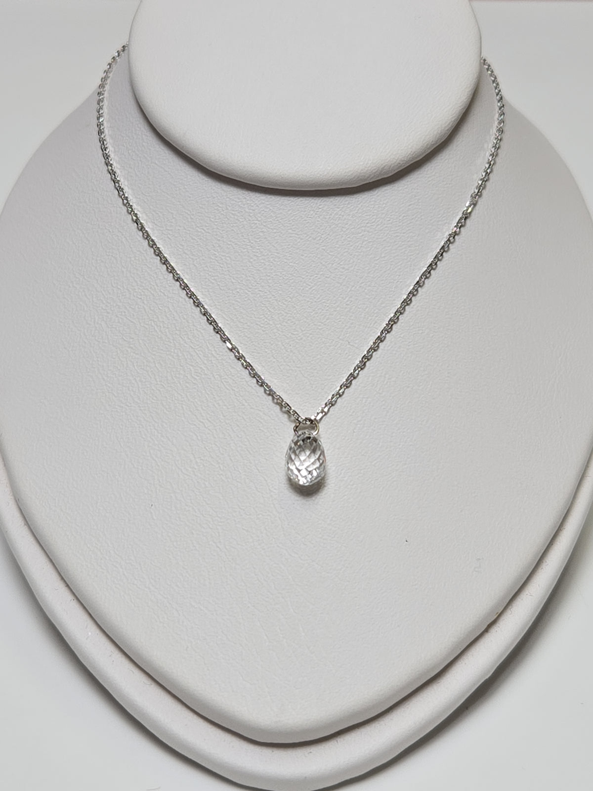 14K white gold pendant featuring a 1ct briolette diamond, elegant jewelry piece with a polished finish and delicate design.