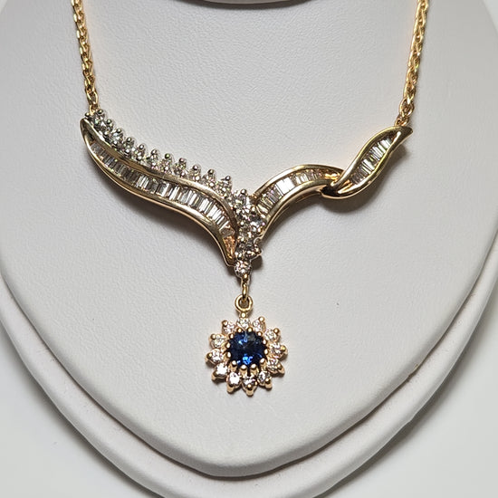 14K gold Spiga chain necklace with 0.2ct round blue sapphire pendant, 16-inch length, by Chique Jewelry.