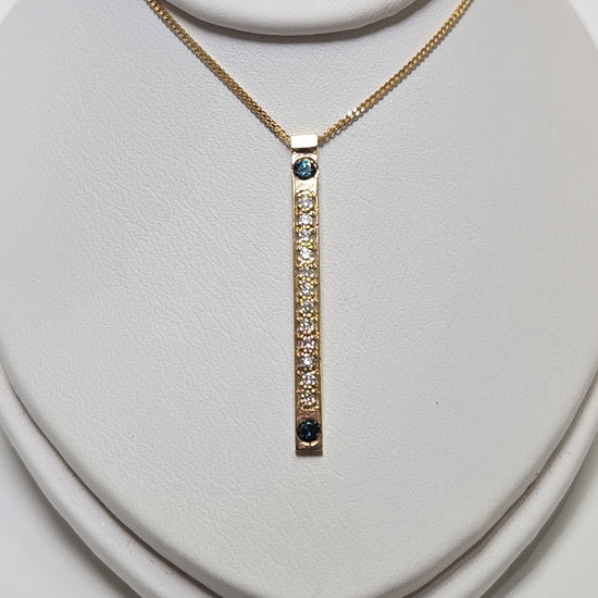 14K gold diamond cut curb chain necklace with blue treated diamonds, featuring a sleek pendant design by Chique Jewelry.