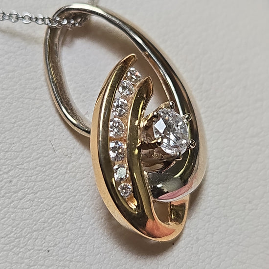 14K gold pendant with 0.53ct round diamonds, featuring a delicate design and weighing 4.4g from Chique Jewelry.