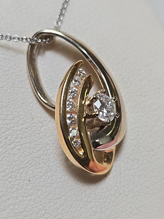 14K gold pendant with 0.53ct round diamonds, featuring a delicate design and weighing 4.4g from Chique Jewelry.