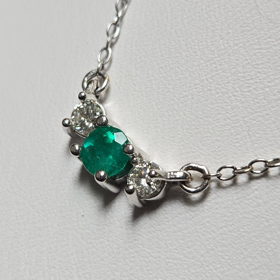 14K white gold cable chain necklace with 0.35ct round emerald pendant, 17-inch length, from Chique Jewelry.