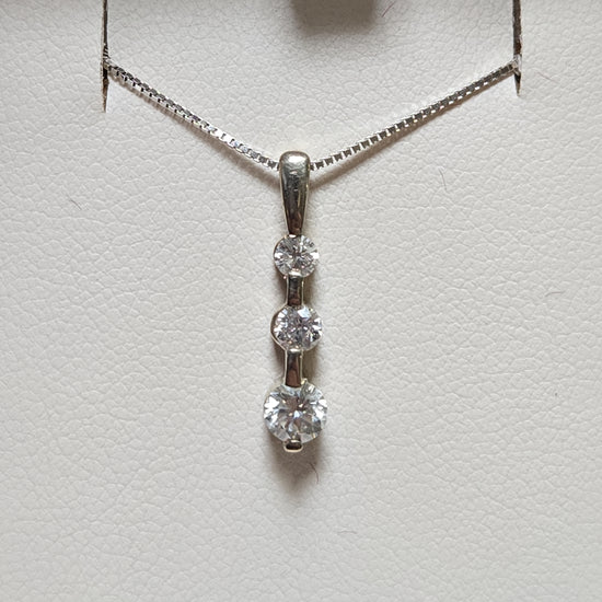 14K gold pendant with 0.3ct round diamonds from Chique Jewelry, showcasing the elegant jewelry piece with sparkling stones.