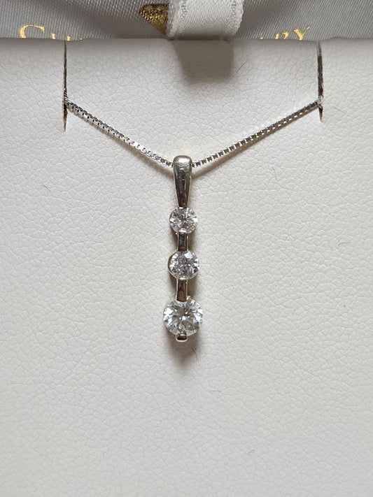 14K gold pendant with 0.3ct round diamonds from Chique Jewelry, showcasing the elegant jewelry piece with sparkling stones.