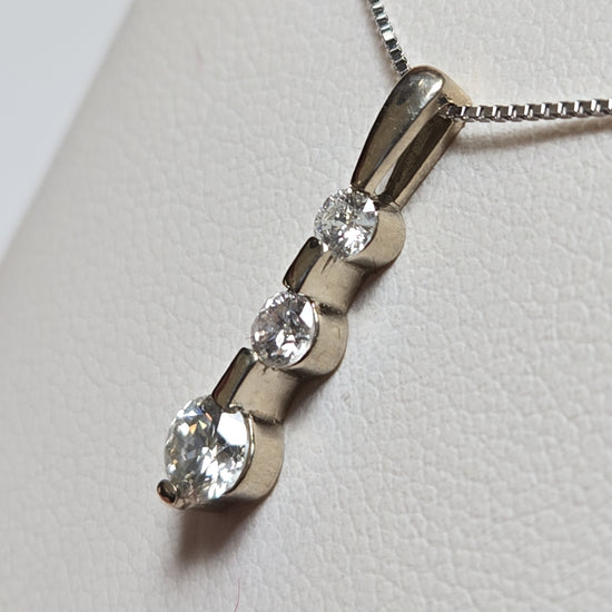 14K gold pendant with 0.3ct round diamonds from Chique Jewelry, showcasing a elegant jewelry piece with sparkling gemstones.