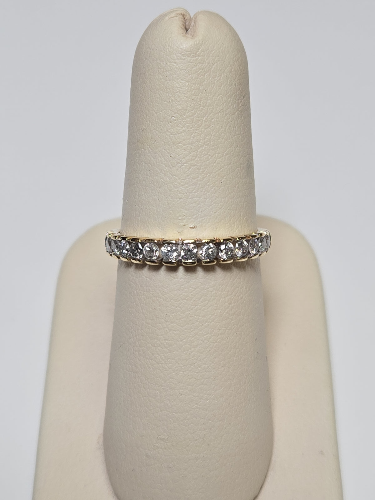 10K gold ring with 0.5ct round diamonds, elegant jewelry piece by Chique Jewelry, featuring a sleek design and sparkling stones.