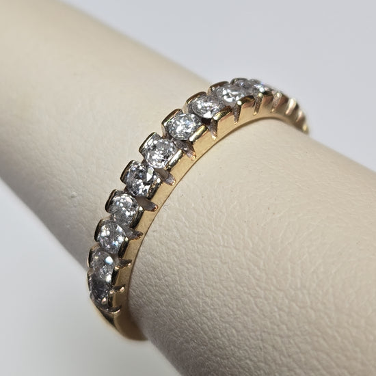 10K gold ring with 0.5ct round diamonds from Chique Jewelry, featuring a sleek band and sparkling gemstone detail.