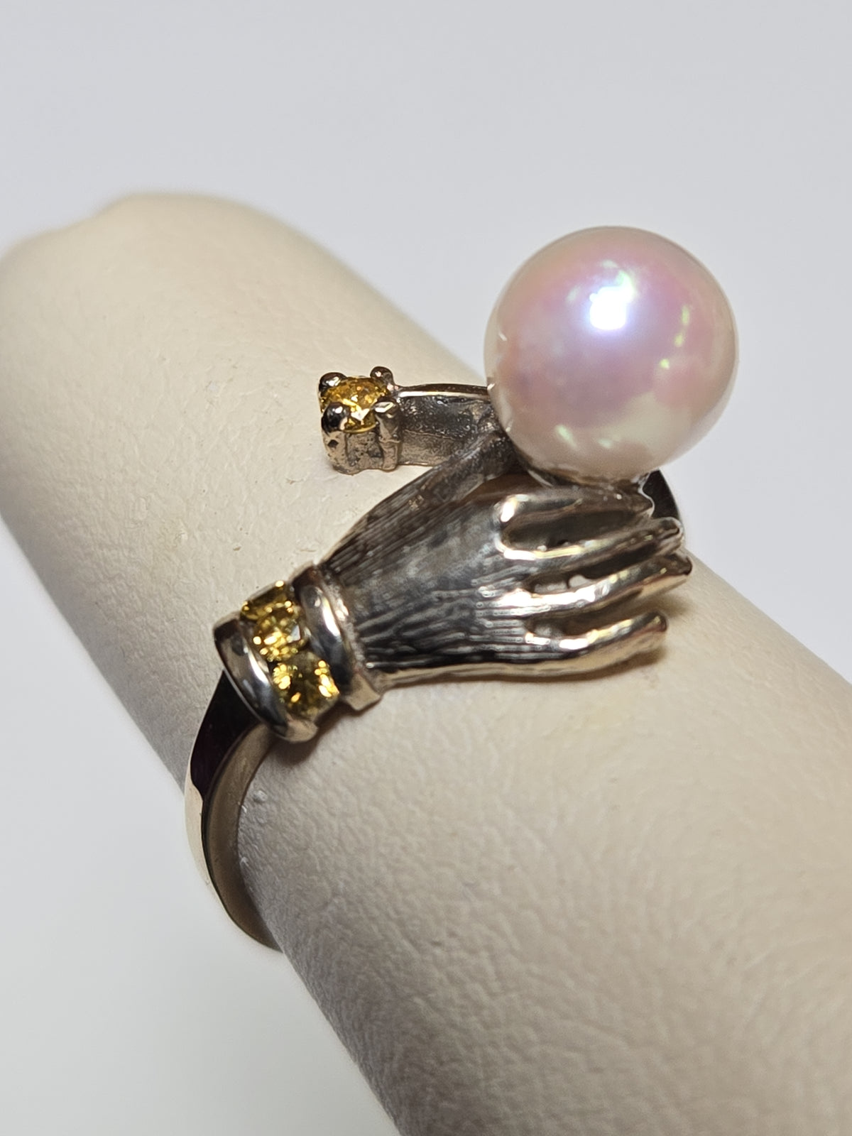 14K multi-tone gold ring with round pearl, elegant jewelry piece showcasing a polished band and a single pearl accent.
