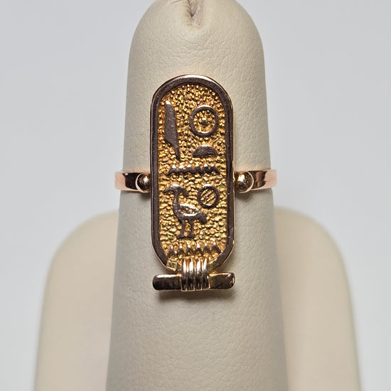 Gold Egyptian hieroglyphics ring by Chique Jewelry, 12K gold, detailed ancient script design, weighs 2.5 grams.