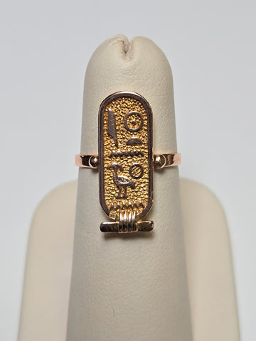 Gold Egyptian hieroglyphics ring by Chique Jewelry, 12K gold, detailed ancient script design, weighs 2.5 grams.