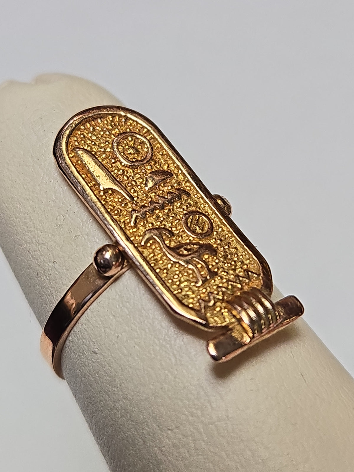 Gold Egyptian hieroglyphics ring by Chique Jewelry, 12K solid gold with detailed hieroglyphic engravings, weighs 2.5 grams.