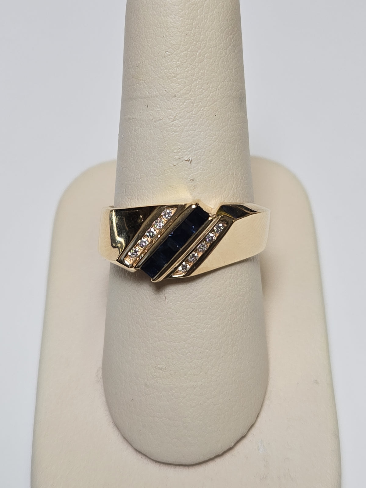 14K gold ring with 0.25ct square blue sapphires and intricate band design, weighing 7.9 grams by Chique Jewelry.