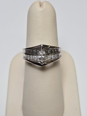 14K white gold ring with 0.2ct marquise diamond, featuring a sleek design and weighing 4.6 grams.