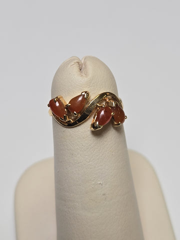 14K gold ring featuring a pear-shaped jade gemstone, weighing 1.6 grams, from Chique Jewelry.